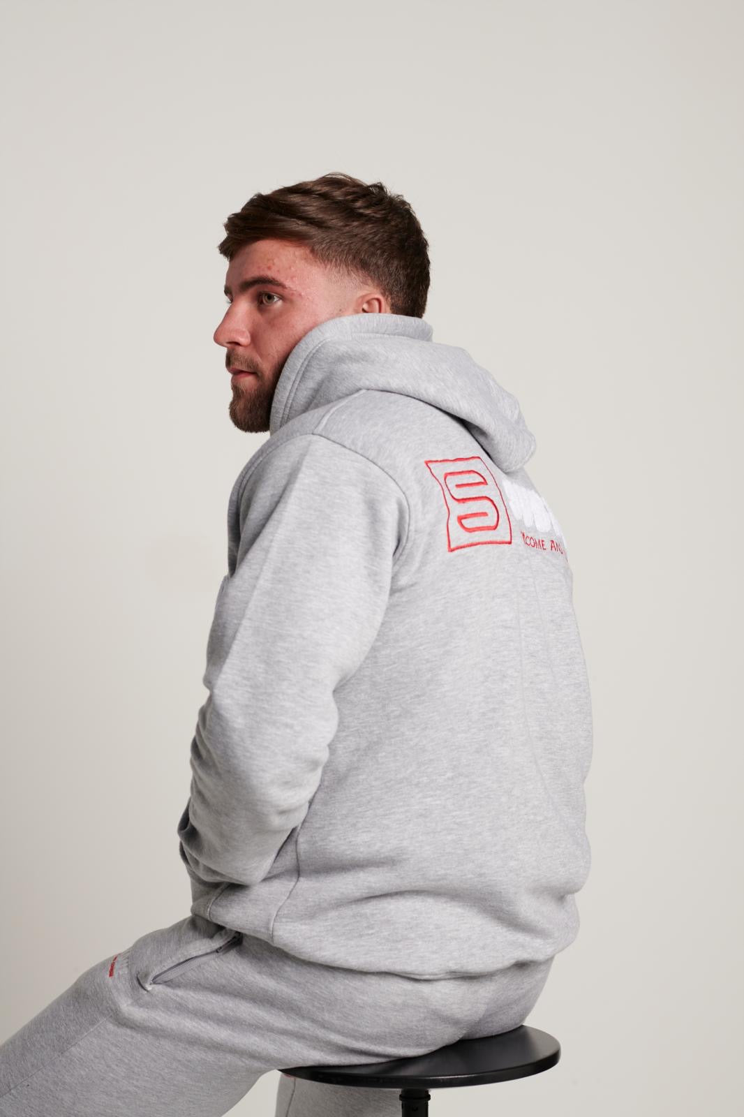 The Chenille Hoodie In Sports Grey With The White & Red Subdue Logo