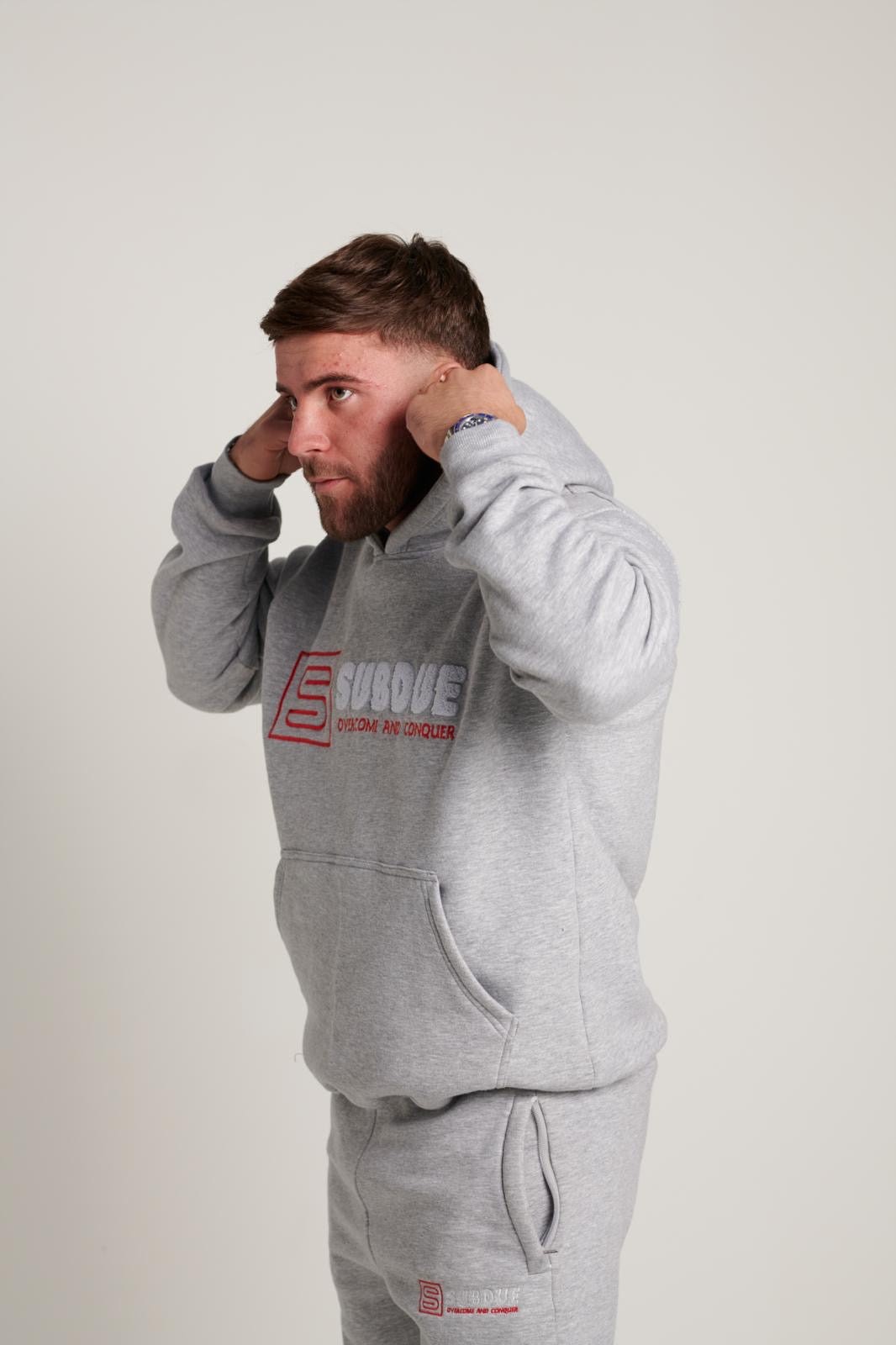 The Chenille Hoodie In Sports Grey With The White & Red Subdue Logo