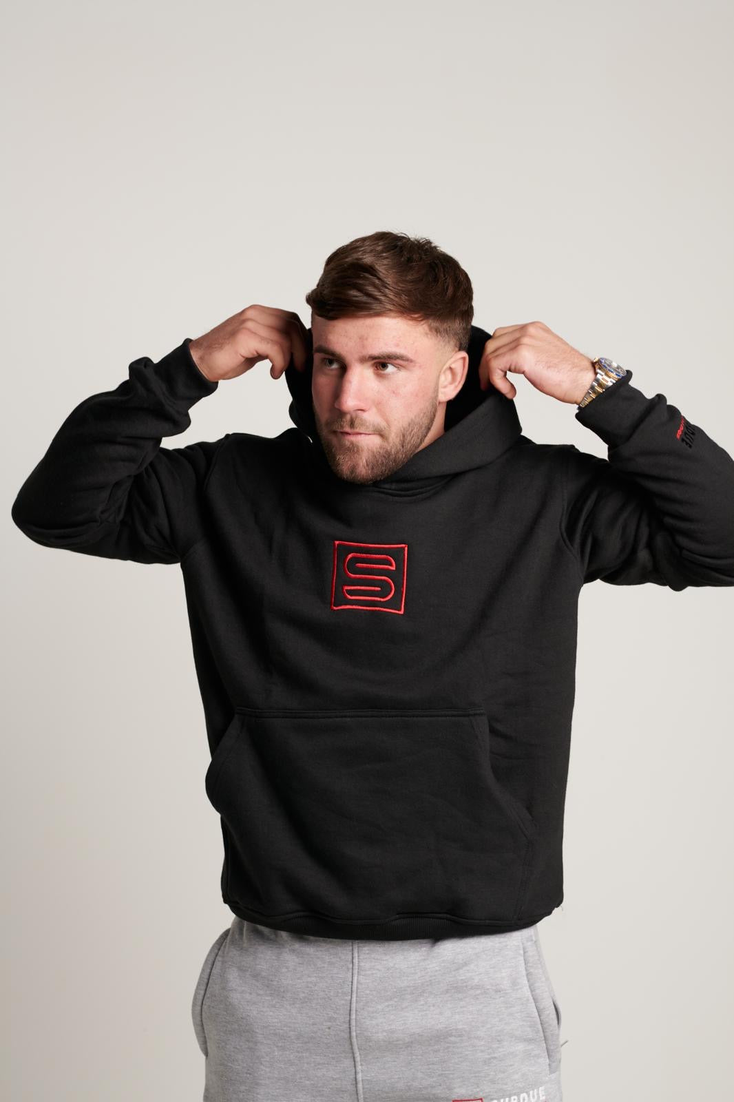 Subdue Midnight Black Large S Logo Hoodie with The Black & Red Trim Logo