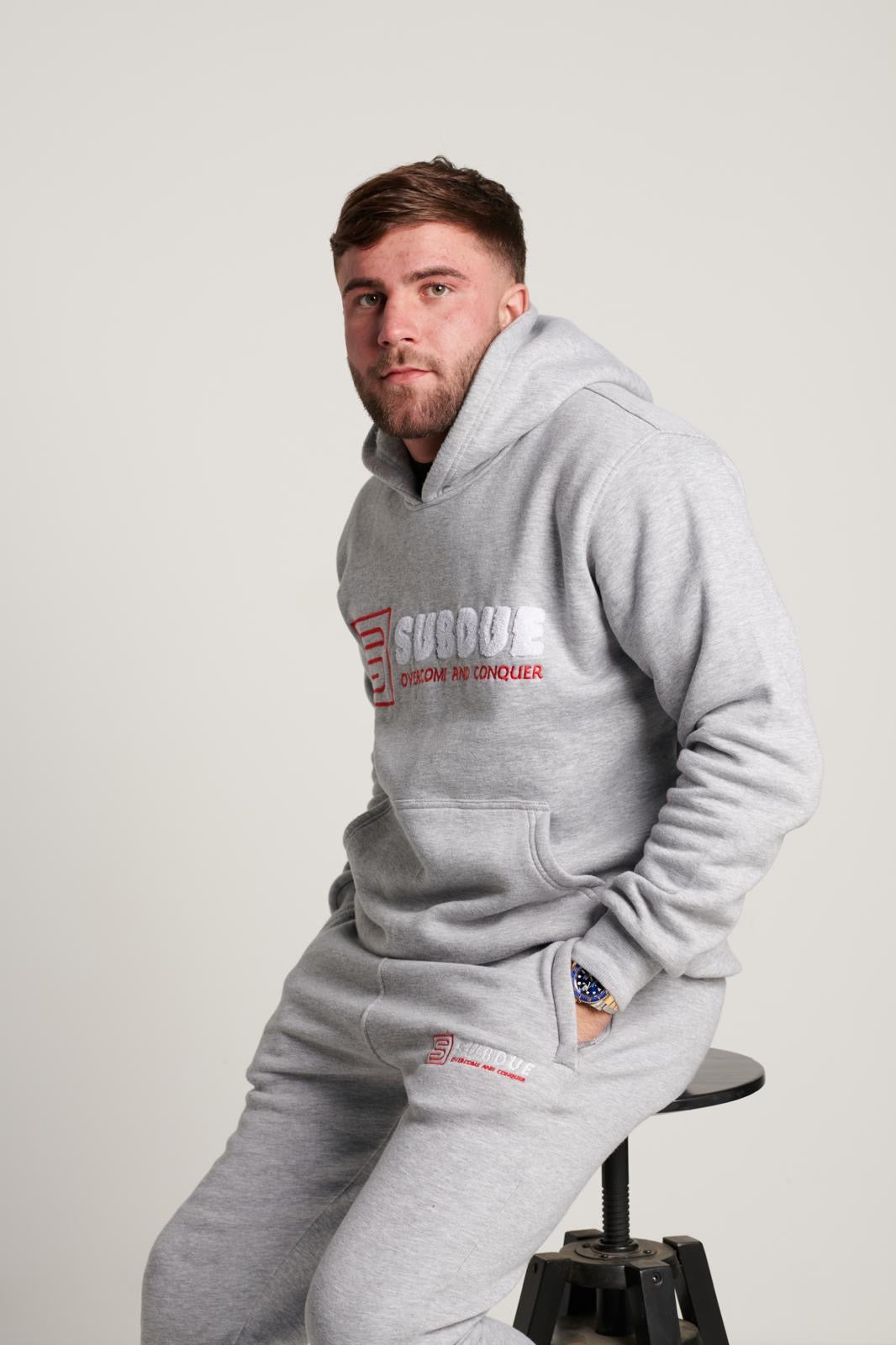 The Chenille Hoodie In Sports Grey With The White & Red Subdue Logo